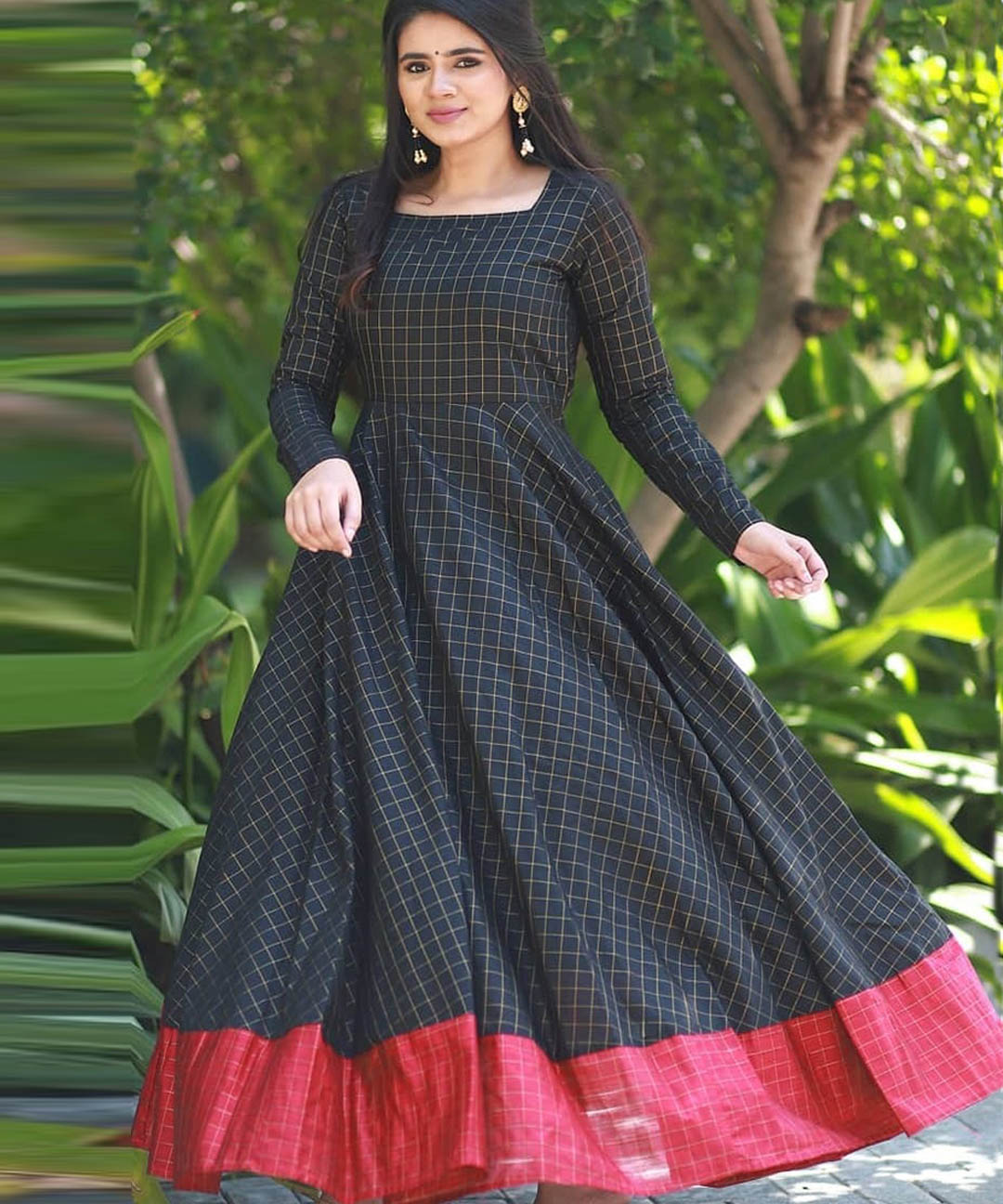 Mesmeric black designer partywear silk jacquard gown, perfect for sophisticated and stylish events.