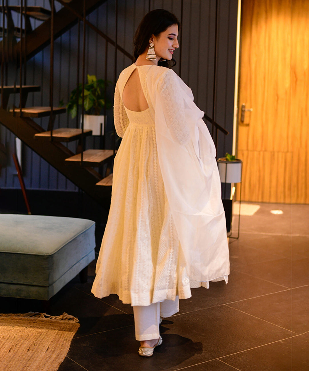 Milky white Georgette Anarkali suit adorned with Lucknowi embroidery, showcasing timeless elegance.