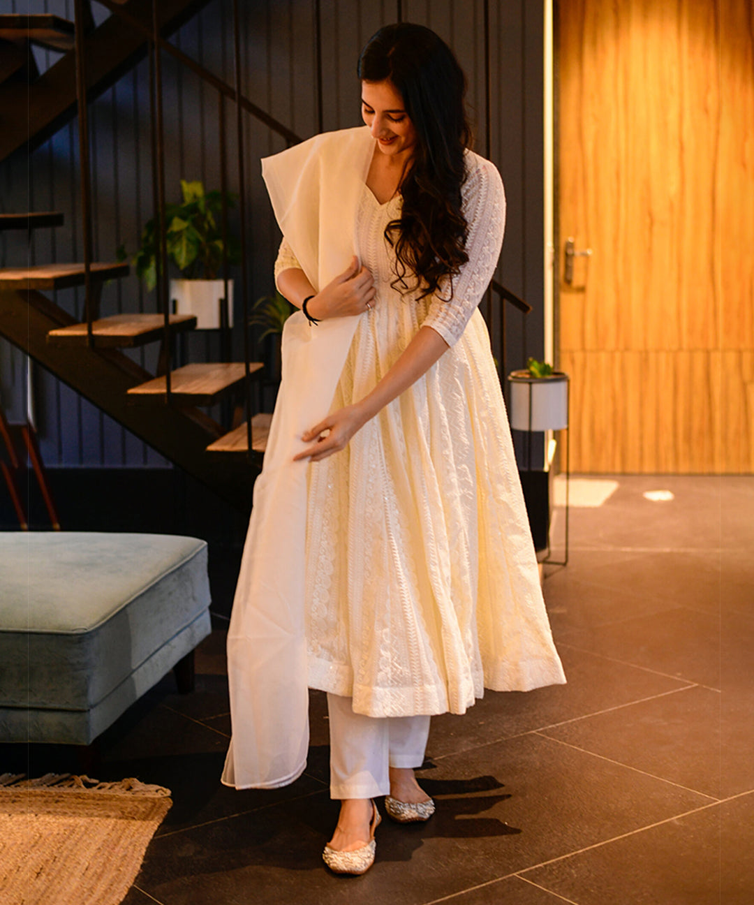 Milky white Georgette Anarkali suit adorned with Lucknowi embroidery, showcasing timeless elegance.