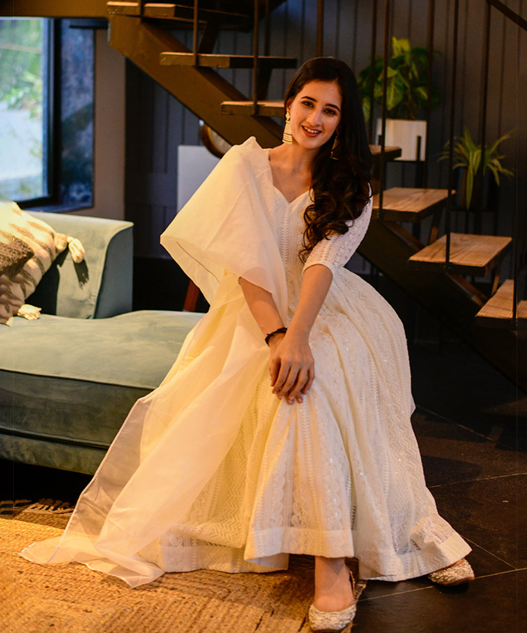 Milky white Georgette Anarkali suit adorned with Lucknowi embroidery, showcasing timeless elegance.