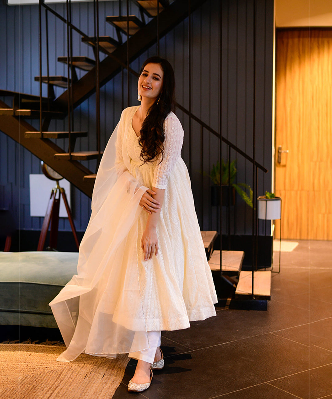 Milky white Georgette Anarkali suit adorned with Lucknowi embroidery, showcasing timeless elegance.
