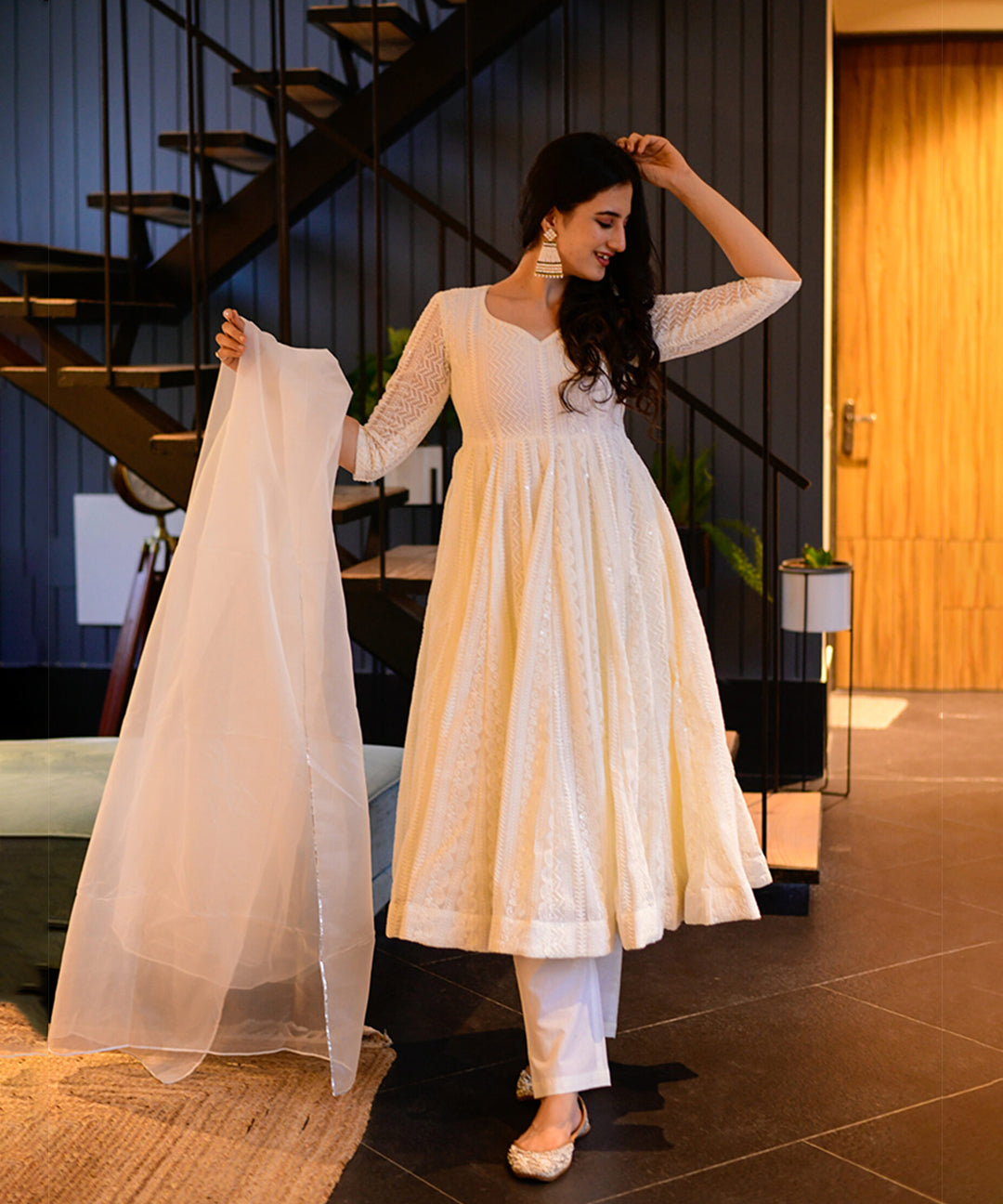 Milky white Georgette Anarkali suit adorned with Lucknowi embroidery, showcasing timeless elegance.