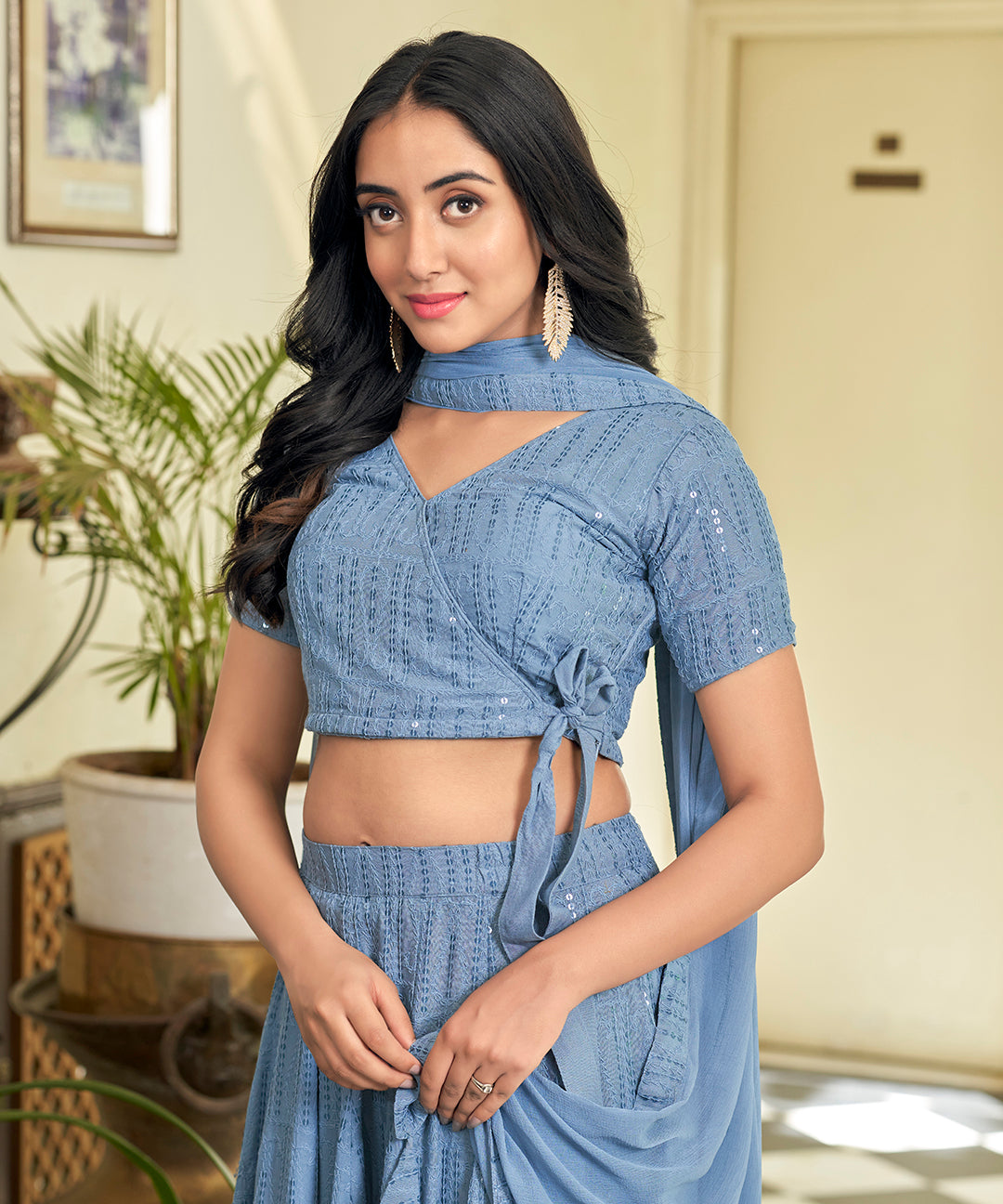 A stylish Powder Blue Rayon Lehenga Set, offering a blend of comfort