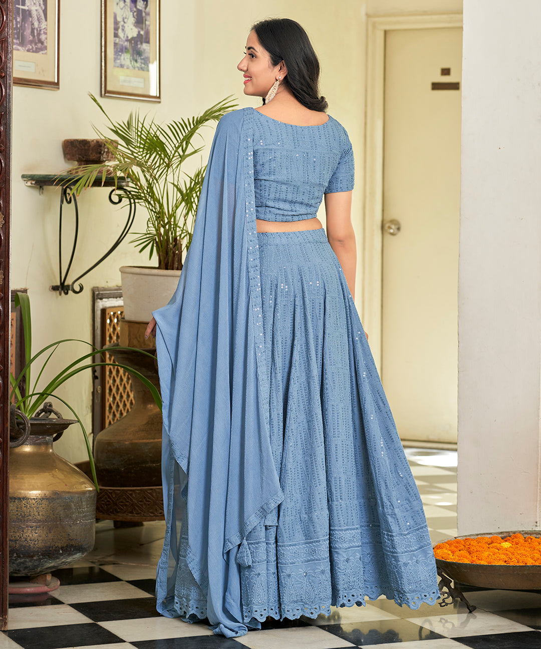 A stylish Powder Blue Rayon Lehenga Set, offering a blend of comfort