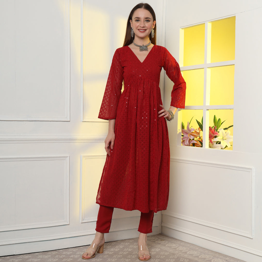 The Show-Stopping Paisley Chikankari Kurta Set with intricate white paisley embroidery on luxurious red fabric.