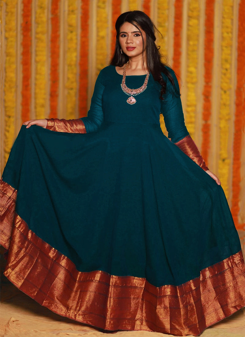 A flowing gown crafted from refreshing turquoise blue woven georgette, perfect for a touch of elegance at your next party.