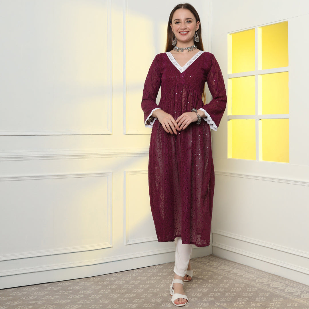 "Glisten with regal charm in the sequinned and embroidered Anarkali kurta set."