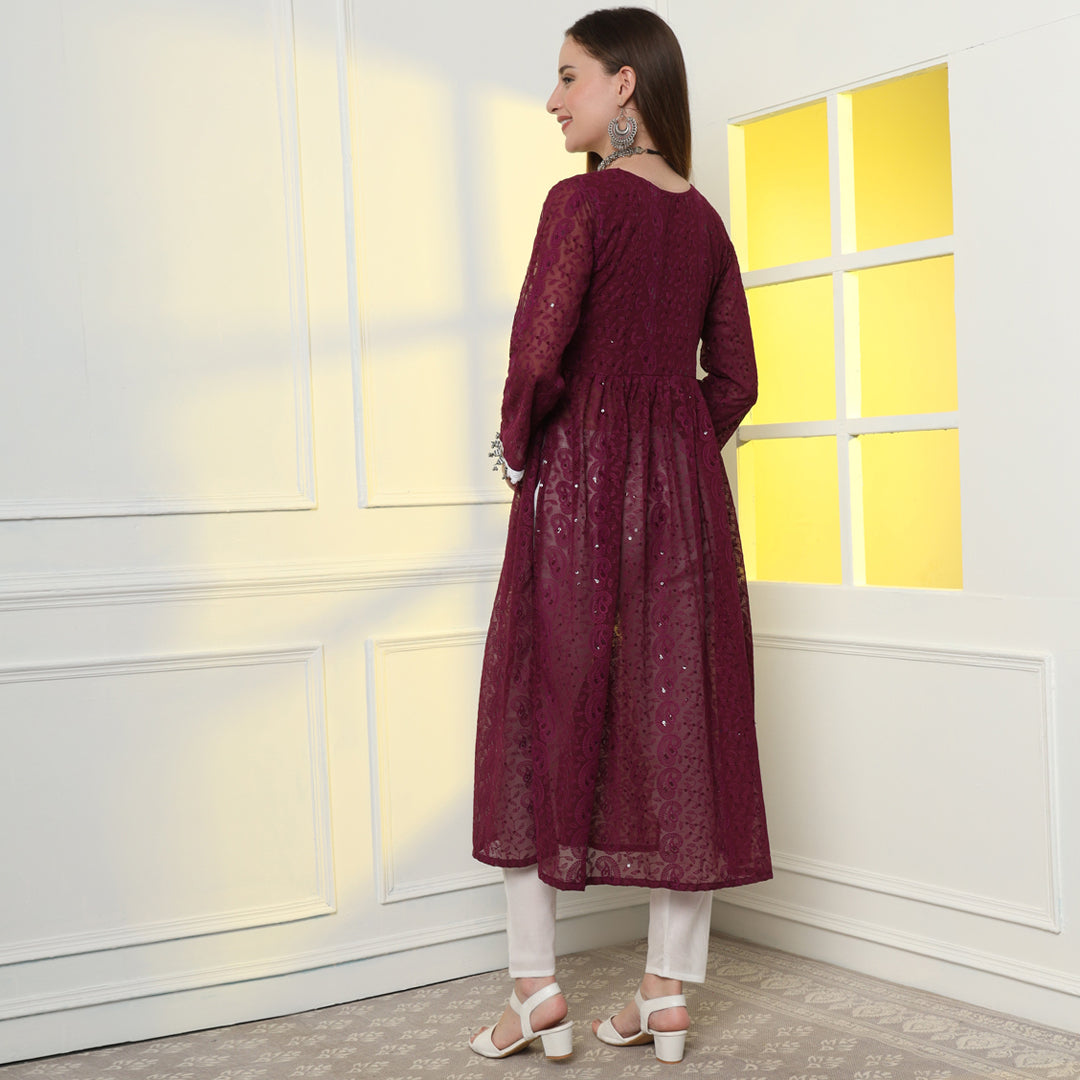 "Glisten with regal charm in the sequinned and embroidered Anarkali kurta set."
