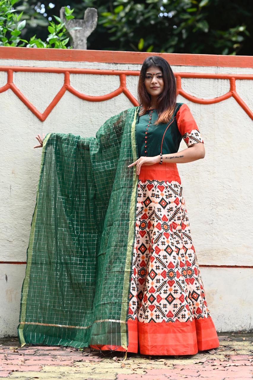 A model showcasing a Sparkling Digital Print Silk Gown, featuring vibrant patterns and a luxurious sheen.