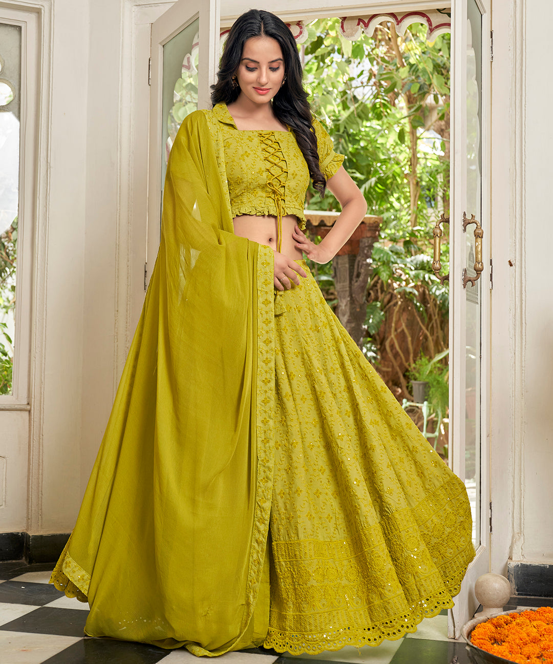 A vibrant Sunset Yellow Rayon Lehenga Set, perfect for adding a pop of color with its stylish design and comfortable fabric.