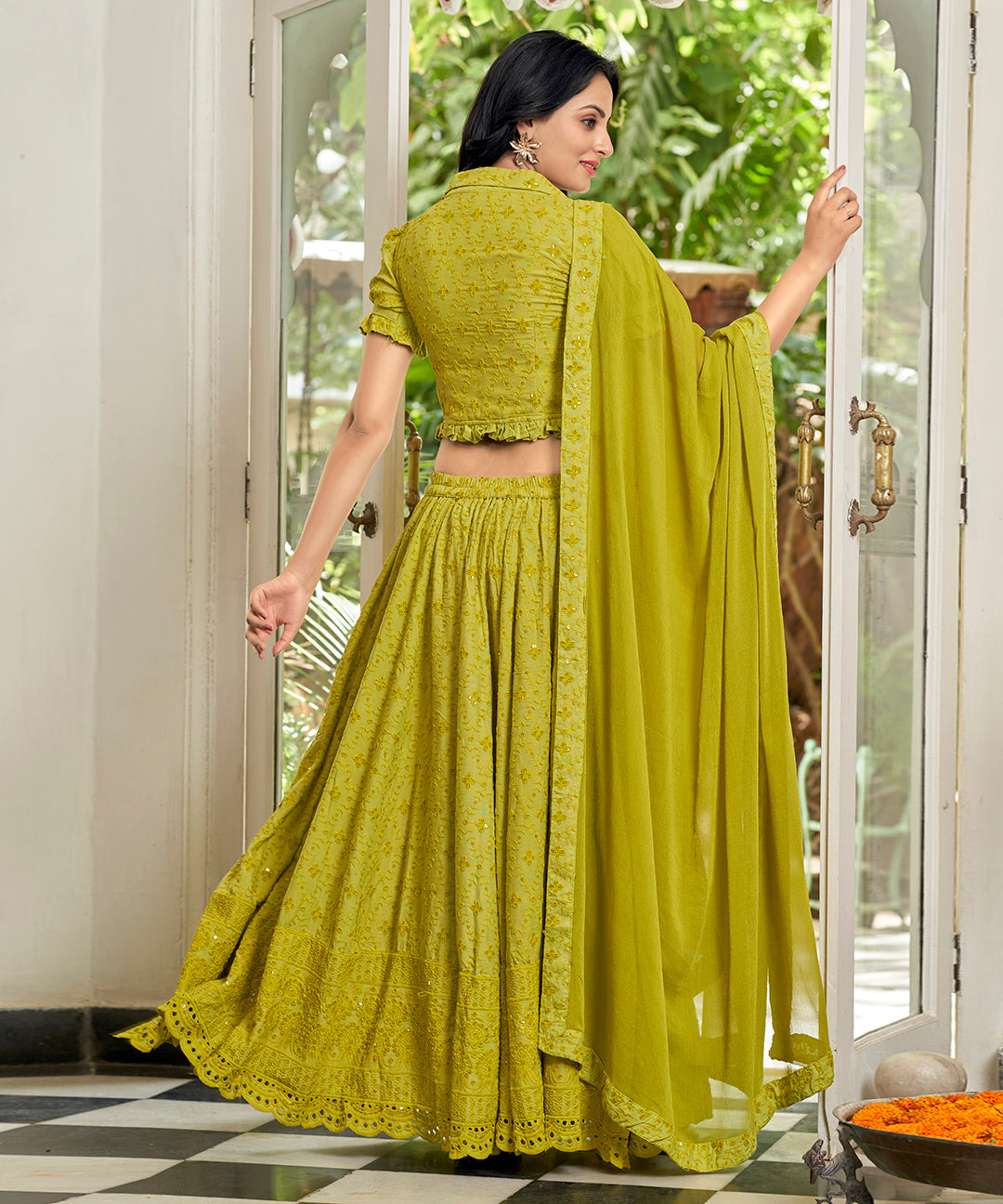 A vibrant Sunset Yellow Rayon Lehenga Set, perfect for adding a pop of color with its stylish design and comfortable fabric.