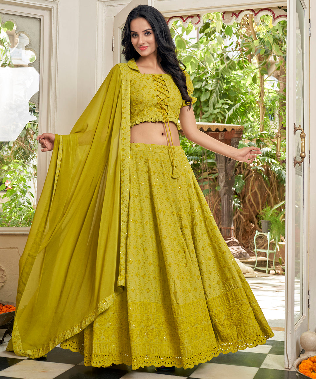 A vibrant Sunset Yellow Rayon Lehenga Set, perfect for adding a pop of color with its stylish design and comfortable fabric.