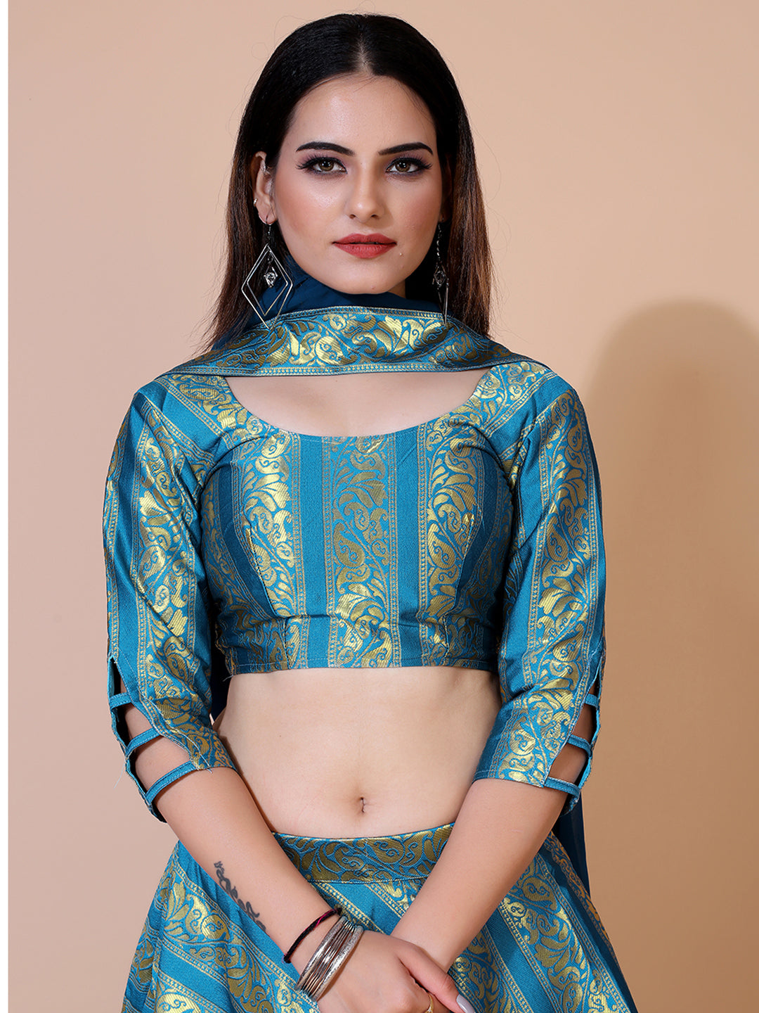 Stunning teal lehenga with a ready-to-wear blouse and matching dupatta, perfect for a festive occasion.