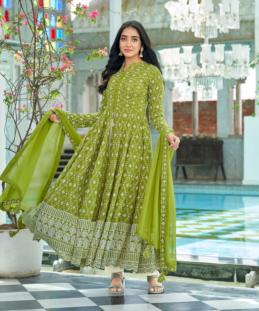 A graceful Tender Green Chikankari Suit Set, embellished with delicate chikankari embroidery for an elegant and refined appearance.