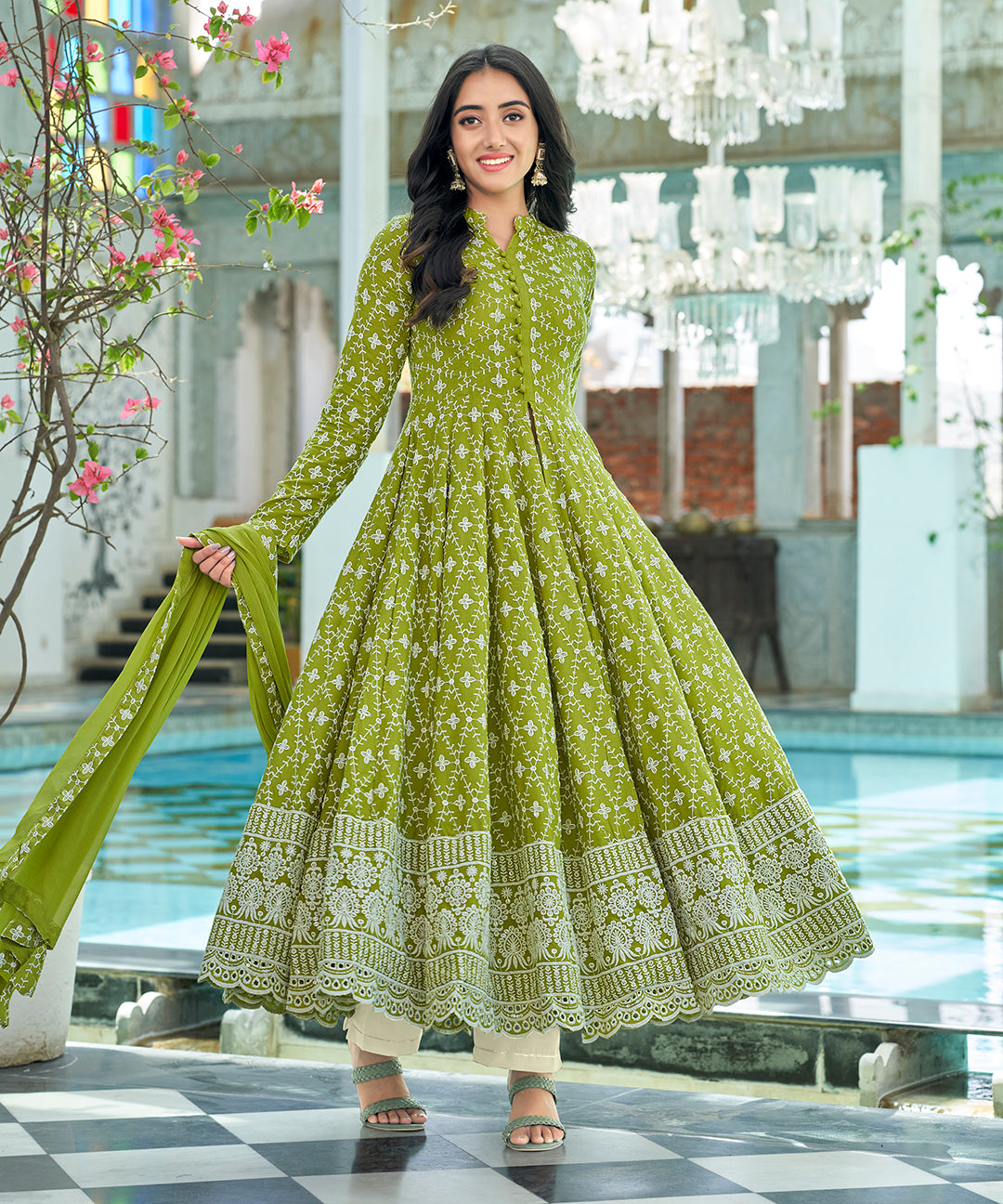 A graceful Tender Green Chikankari Suit Set, embellished with delicate chikankari embroidery for an elegant and refined appearance.