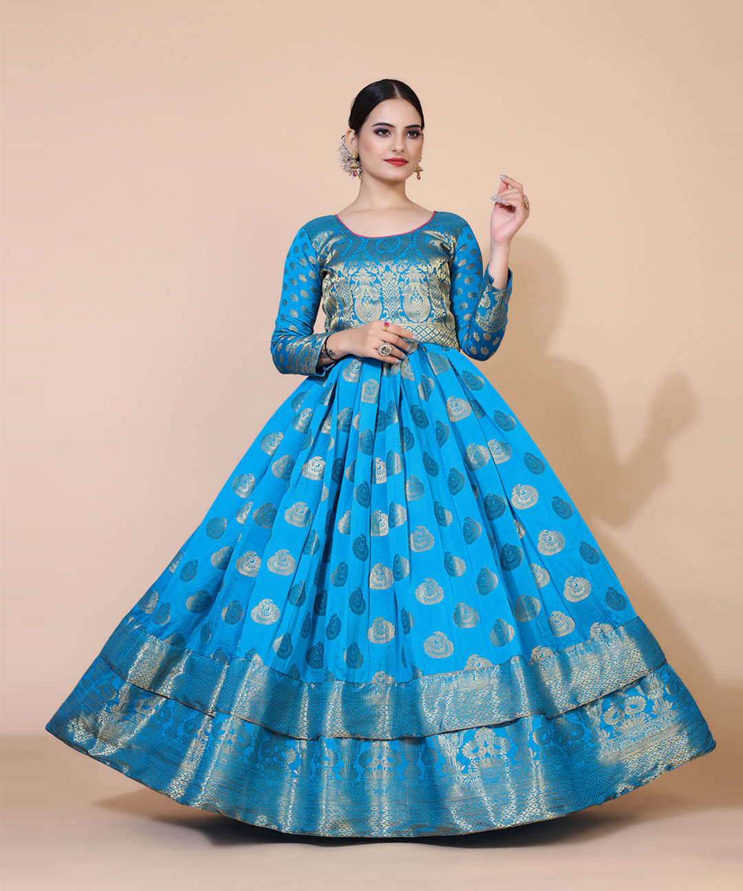 Turquoise blue jacquard maxi dress adorned with ethnic motifs, perfect for cultural and festive occasions.