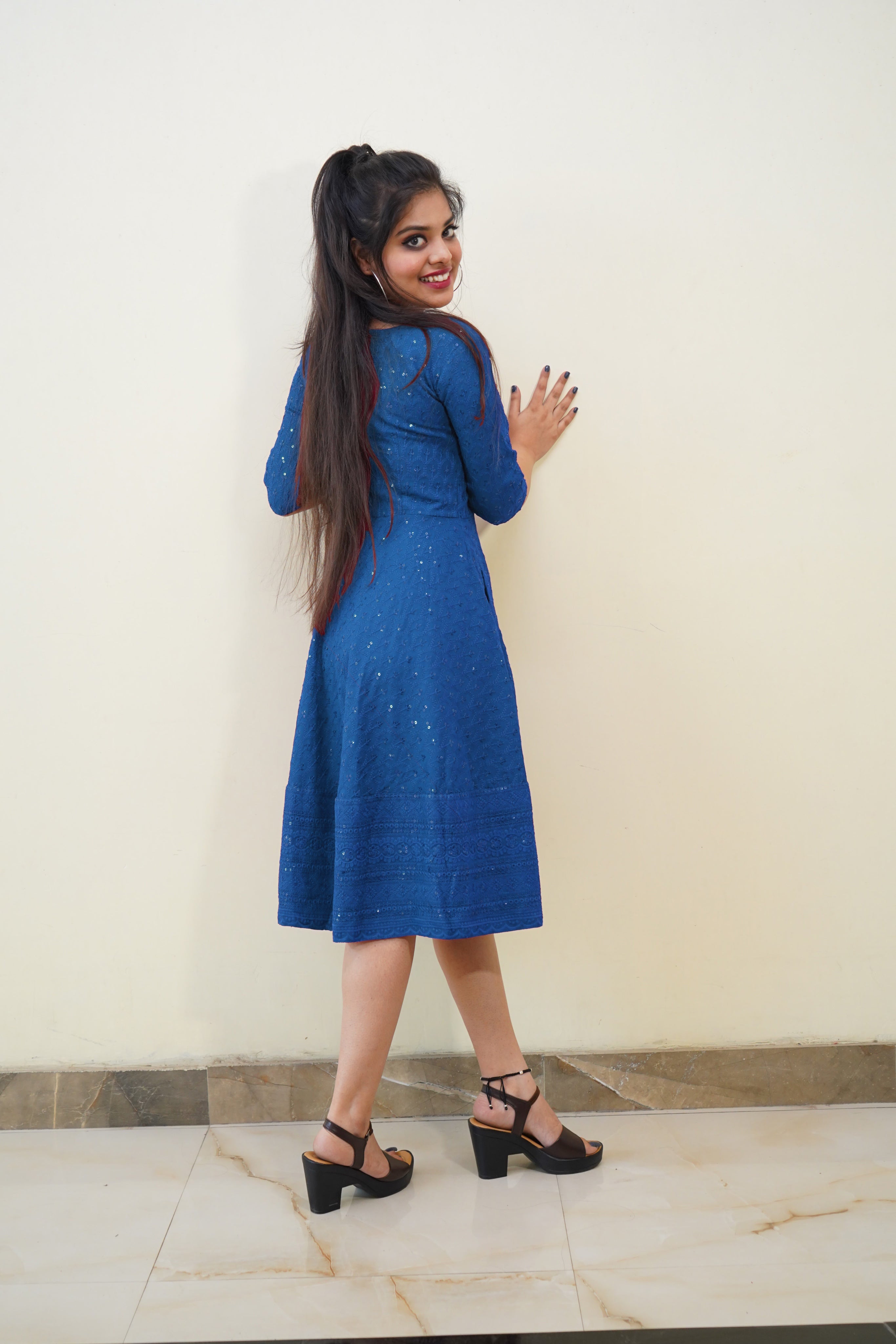 Flowing turquoise rayon dress featuring intricate Lucknowi Chikankari embroidery, perfect for parties.