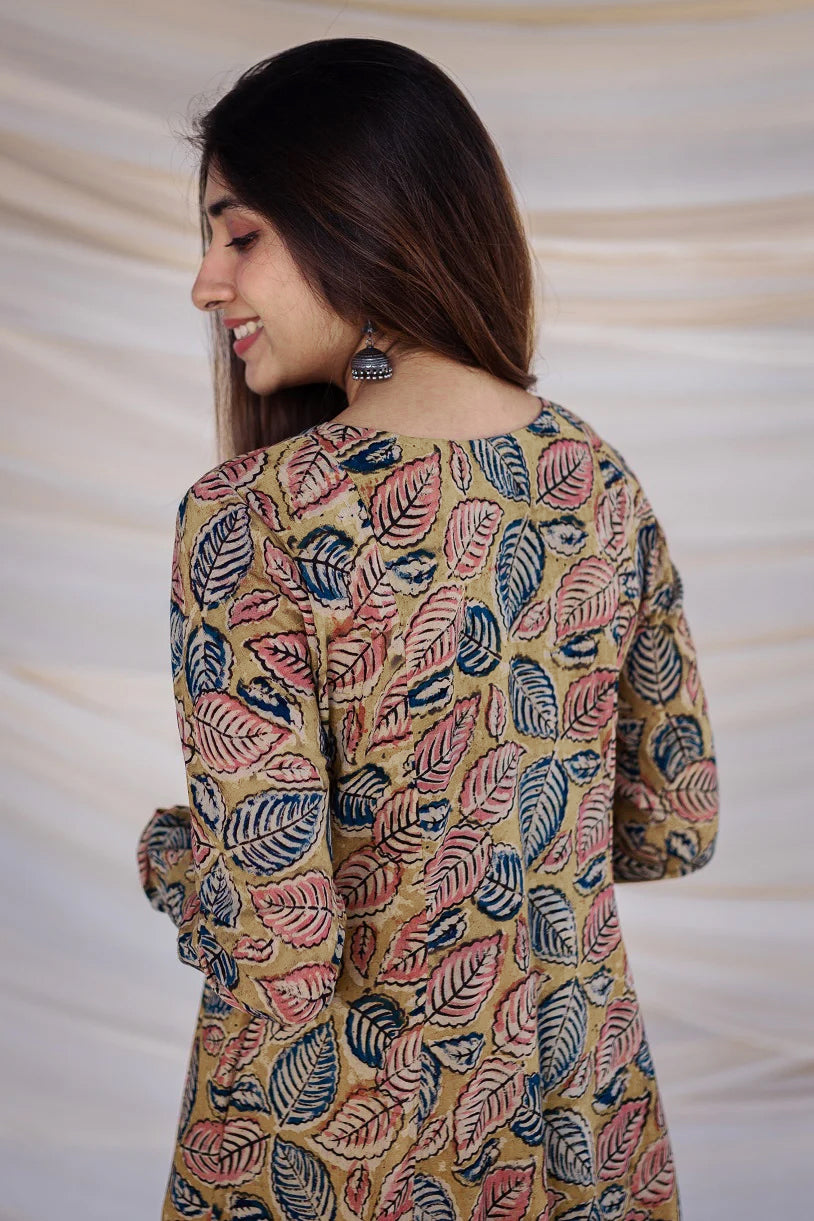 Sunny Yellow Kurta with Pockets: A cheerful yellow kurta made from comfortable cotton, featuring traditional Kalamkari designs and handy pockets.