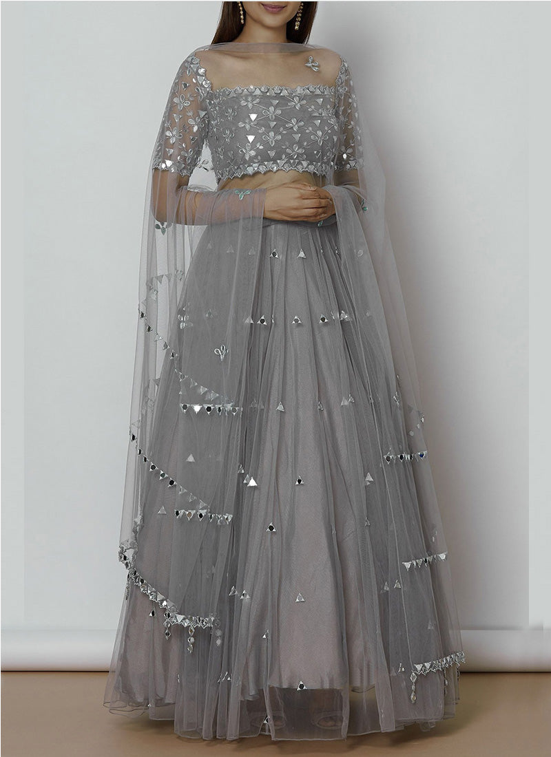 Hot stylish designer wear grey foil mirror-embroidered lehenga with unstitched blouse, perfect for glamorous and festive occasions.