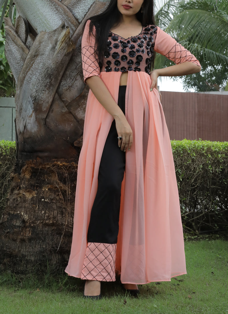 Ideal peach colored partywear georgette top-bottom palazzo set, perfect for elegant and festive occasions.