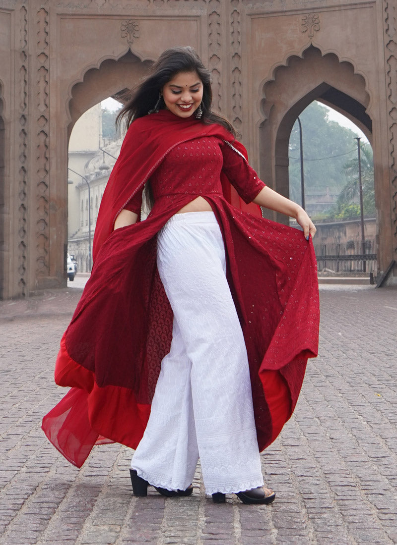 Maroon Chikankari kurta with palazzo and dupatta, ideal for traditional and festive occasions with intricate embroidery.