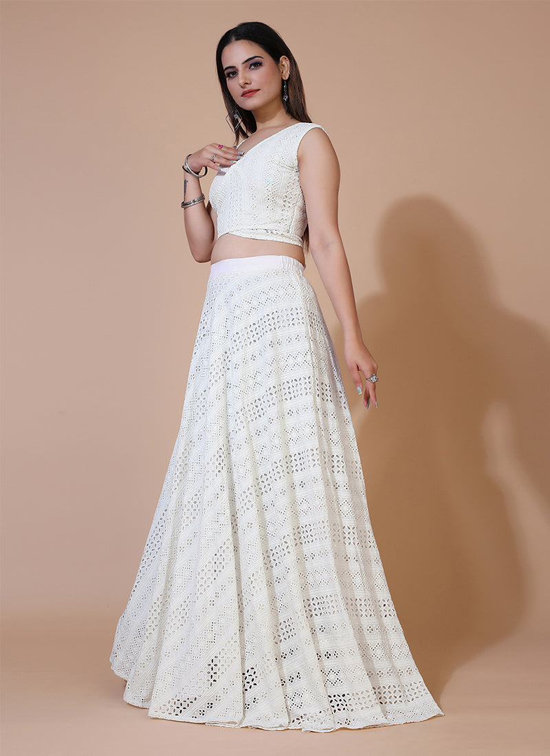 Milky white stylish lehenga with Angrakha style sleeveless crop top, ideal for modern and elegant occasions.