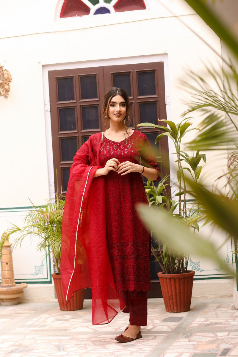Red Chikankari suit set with intricate embroidery, perfect for traditional and festive occasions.