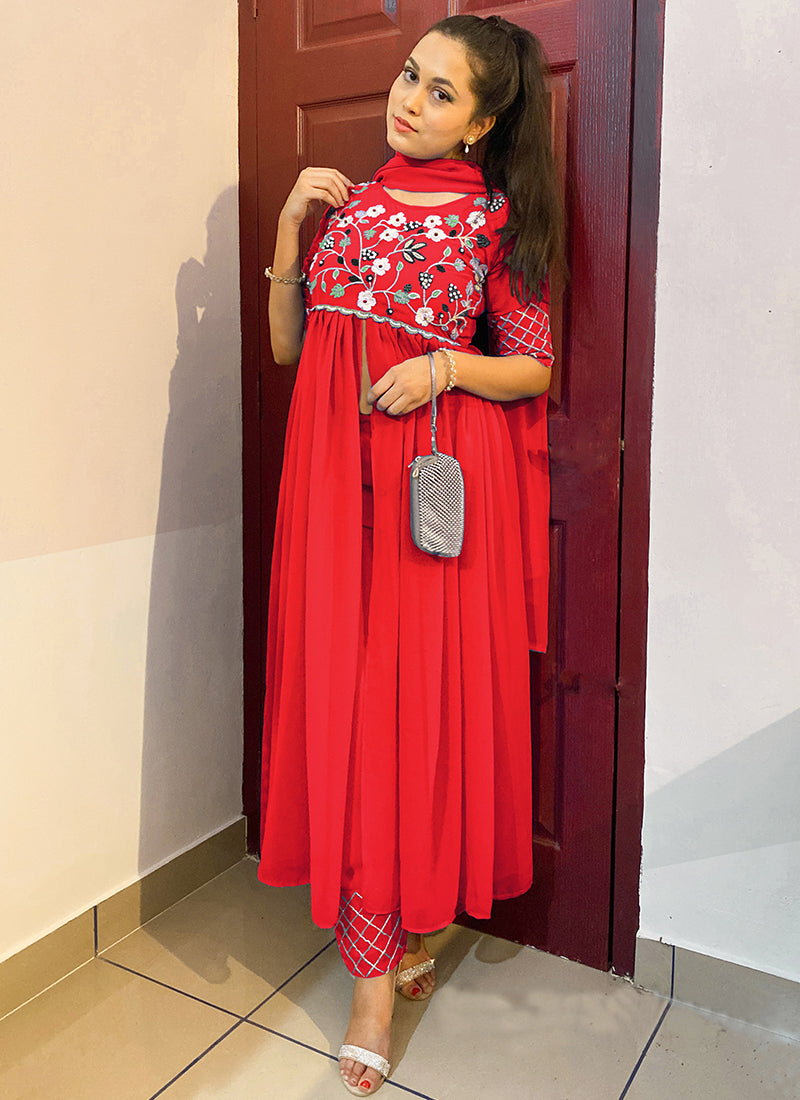 Tomato red colored partywear embroidered georgette top-bottom set, perfect for festive and stylish occasions.