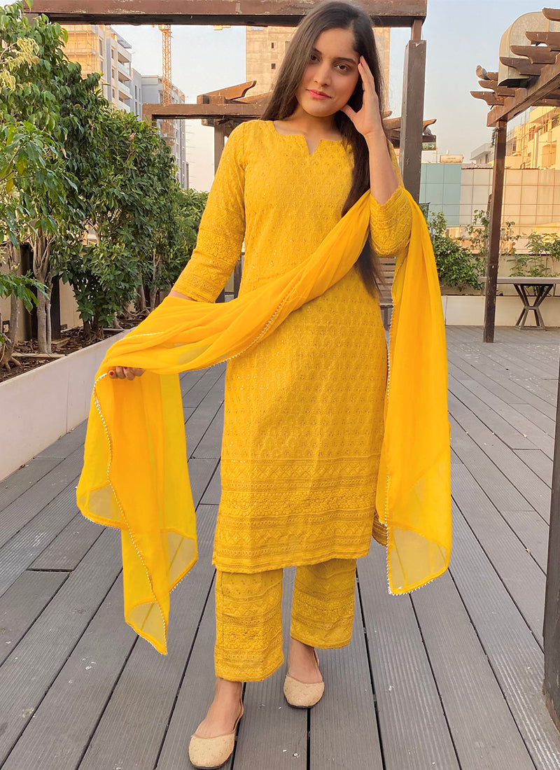 Yellow Chikankari suit set with intricate embroidery, perfect for traditional and festive occasions.