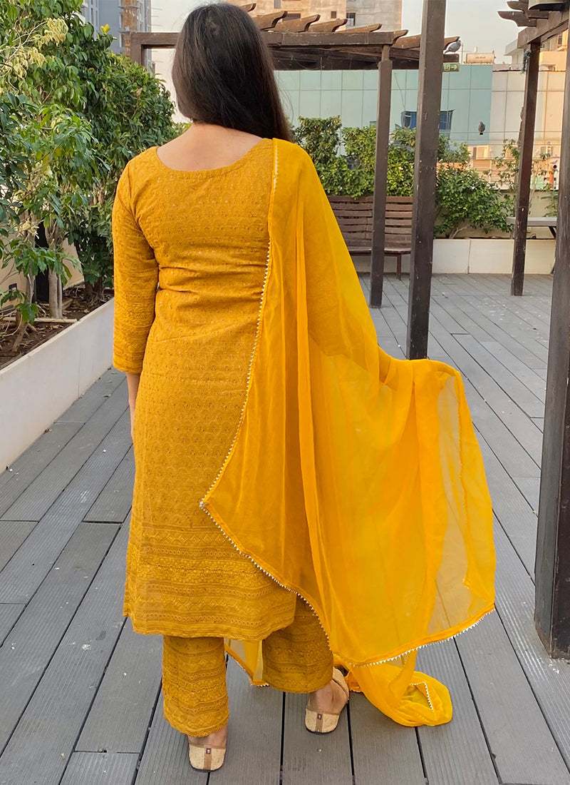 Yellow Chikankari suit set with intricate embroidery, perfect for traditional and festive occasions.