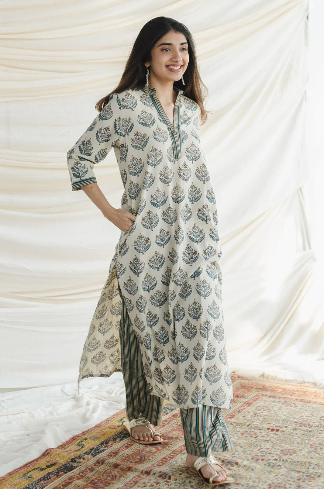 Ajrakh Cotton Kurta Palazzo Set: A comfortable two-piece set featuring a straight kurta and wide-leg palazzo pants, both made from breathable cotton and adorned with traditional Ajrakh block prints.