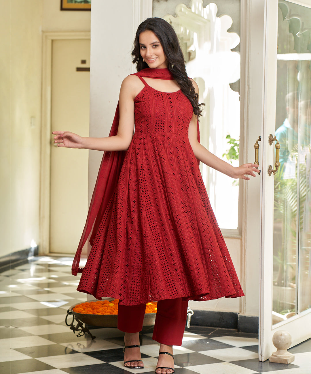 Carmine red Anarkali suit set featuring a rich color and elegant design