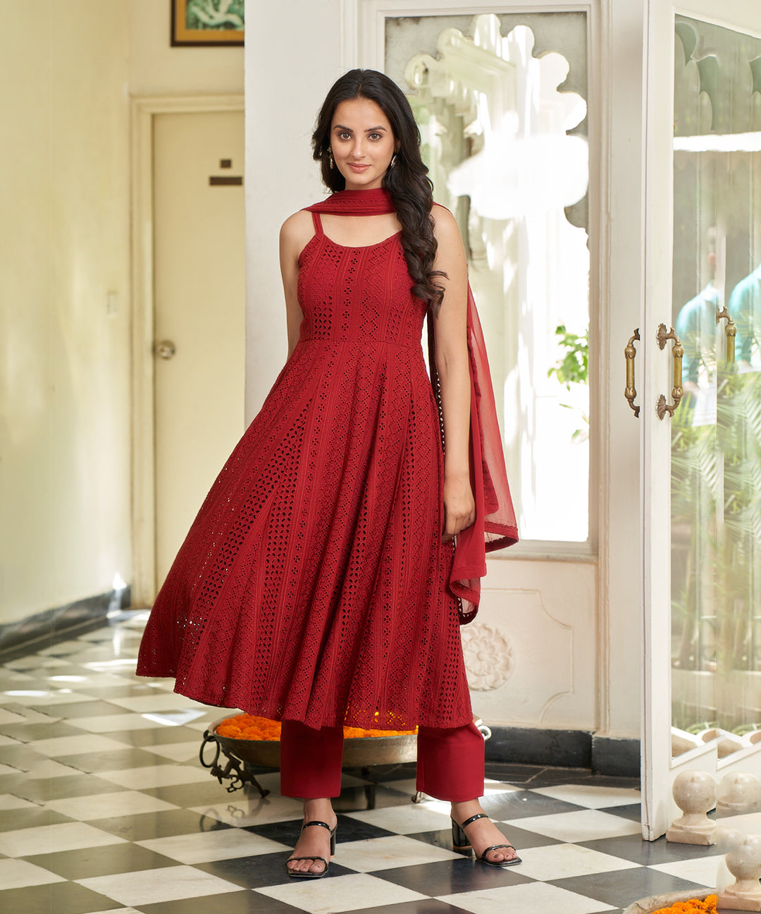 Carmine red Anarkali suit set featuring a rich color and elegant design