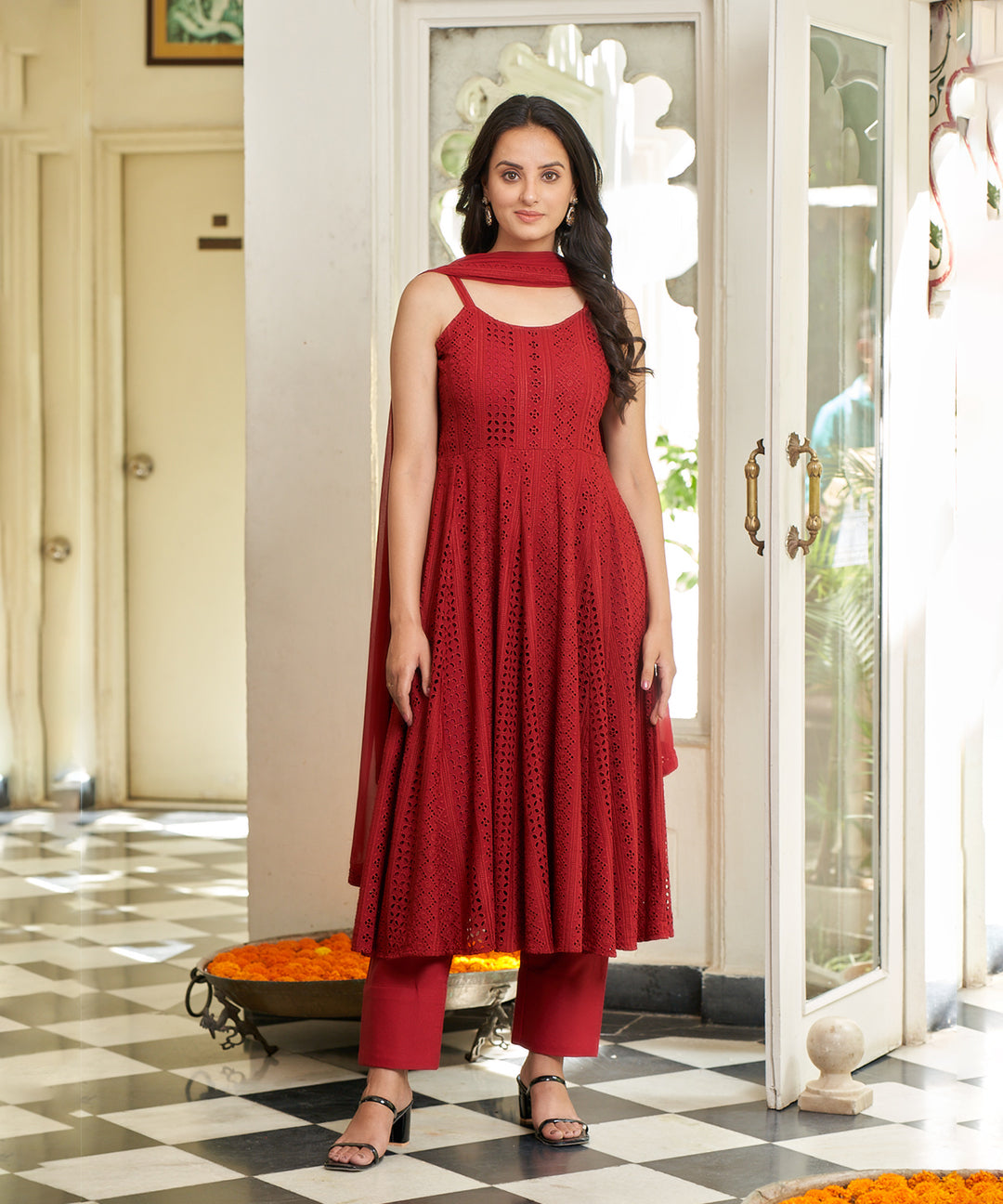 Carmine red Anarkali suit set featuring a rich color and elegant design