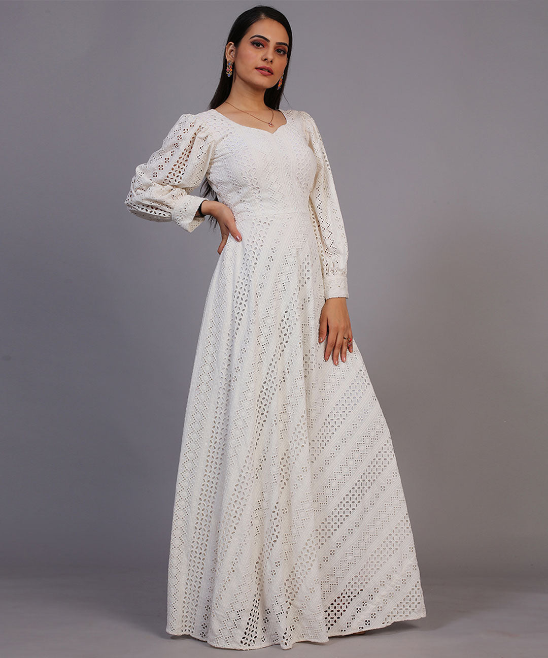 Classic off-white Lucknowi embroidered floor-length gown, showcasing timeless elegance and craftsmanship.