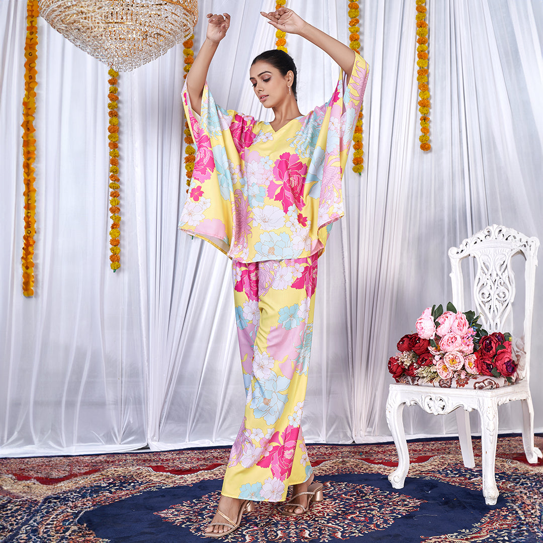 A stylish floral printed kaftan style co-ord set with flowing sleeves and matching wide-leg pants.