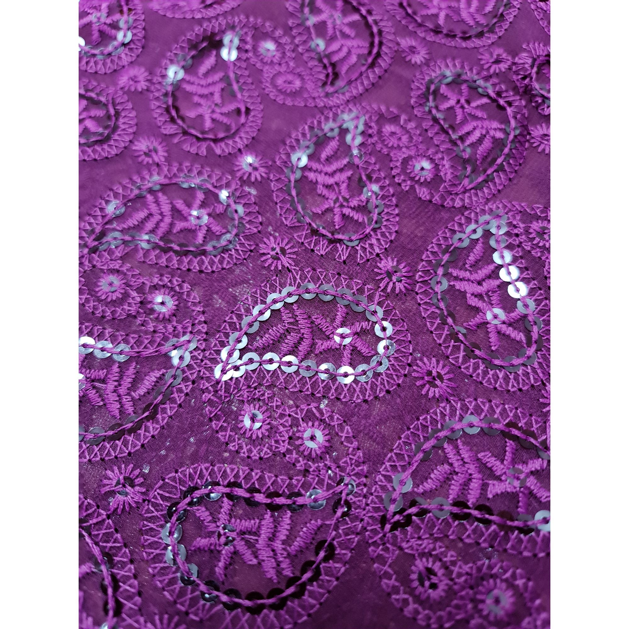 A stunning long kurta in a captivating shade of purple, adorned with intricate Chikankari embroidery and stylish side tassels.