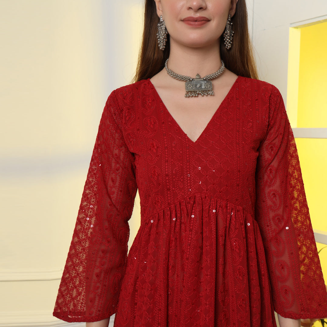 The Show-Stopping Paisley Chikankari Kurta Set with intricate white paisley embroidery on luxurious red fabric.