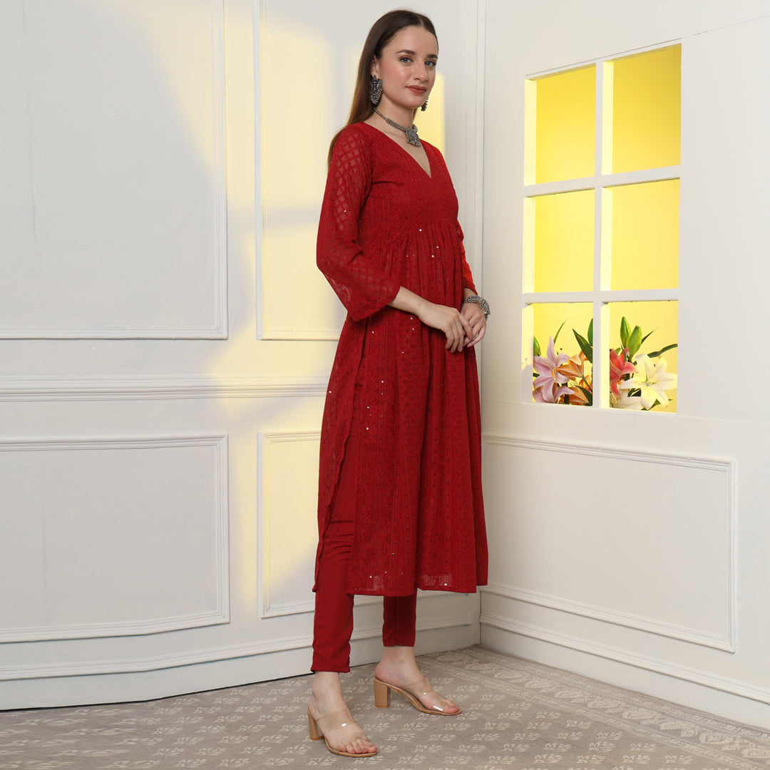 The Show-Stopping Paisley Chikankari Kurta Set with intricate white paisley embroidery on luxurious red fabric.