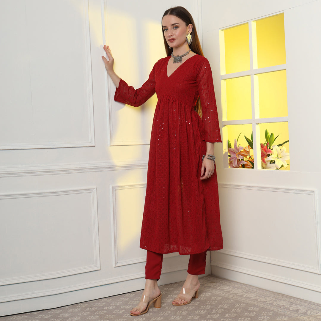 The Show-Stopping Paisley Chikankari Kurta Set with intricate white paisley embroidery on luxurious red fabric.