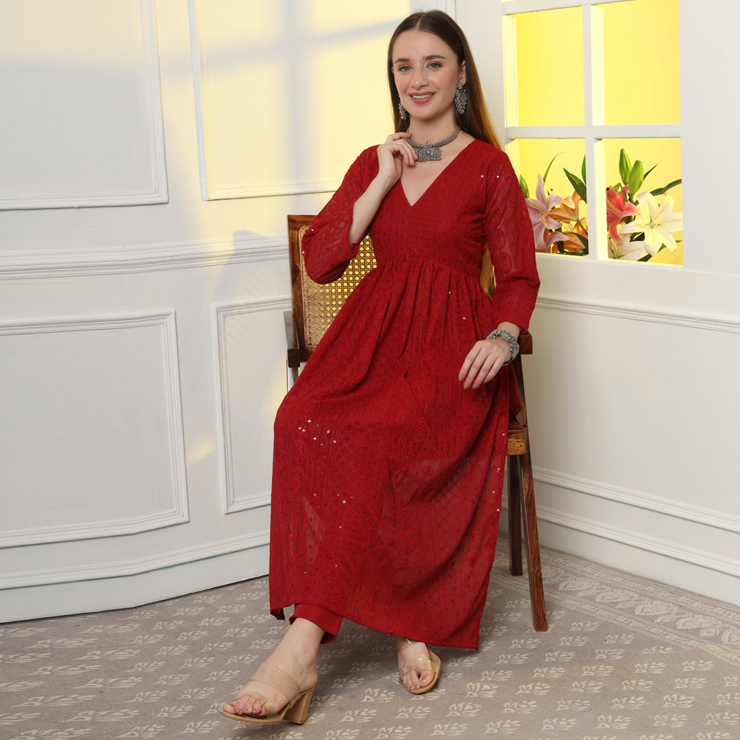 The Show-Stopping Paisley Chikankari Kurta Set with intricate white paisley embroidery on luxurious red fabric.