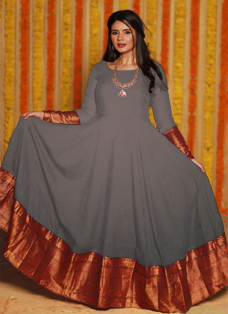 Sophisticated dark grey party wear woven georgette gown offering a refreshing and elegant look for special occasions.