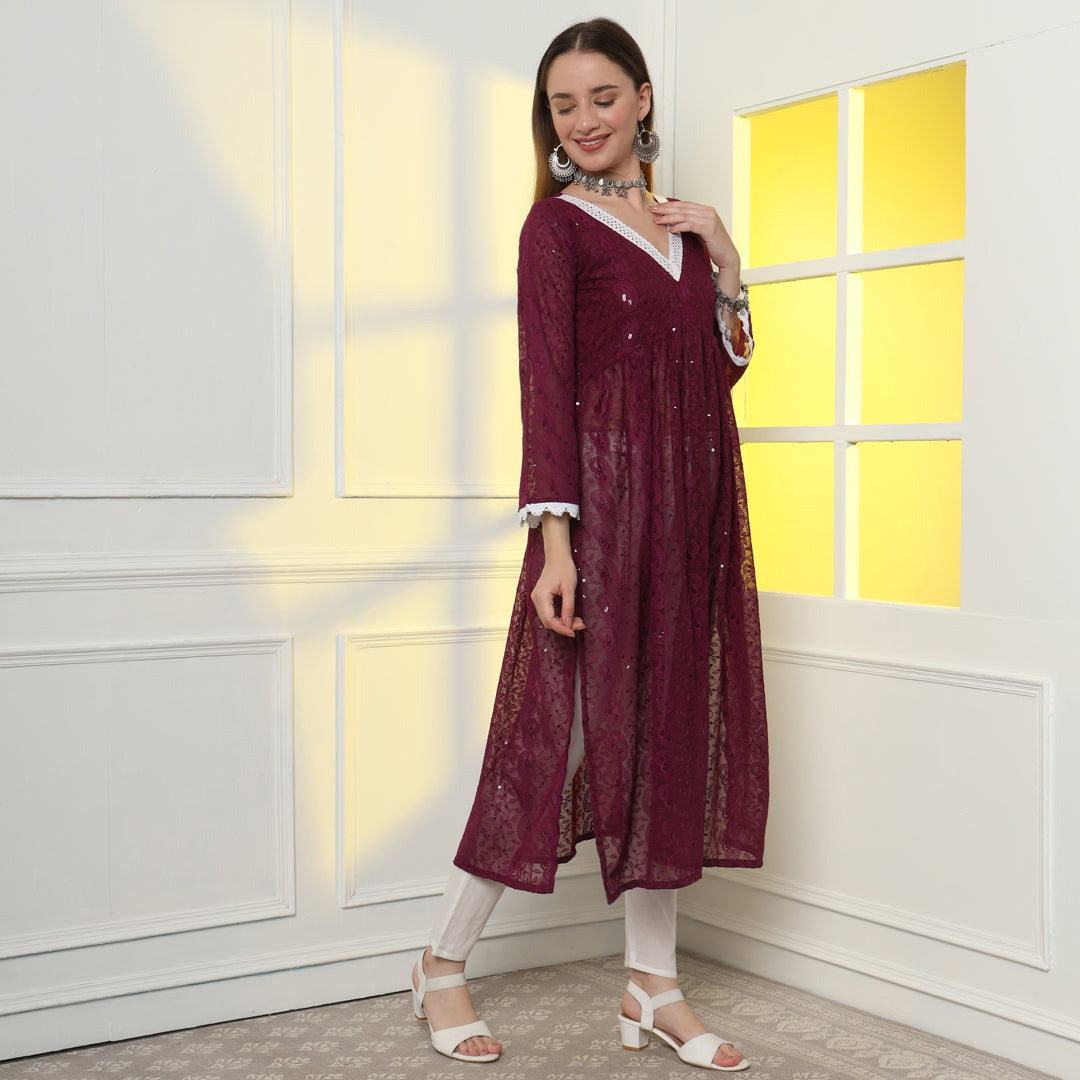 "Glisten with regal charm in the sequinned and embroidered Anarkali kurta set."