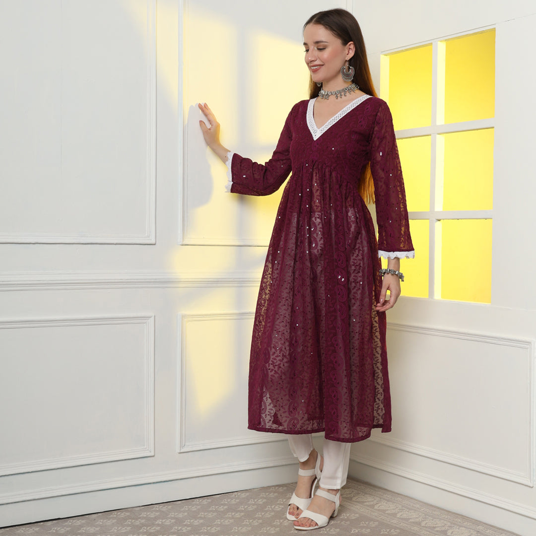 "Glisten with regal charm in the sequinned and embroidered Anarkali kurta set."