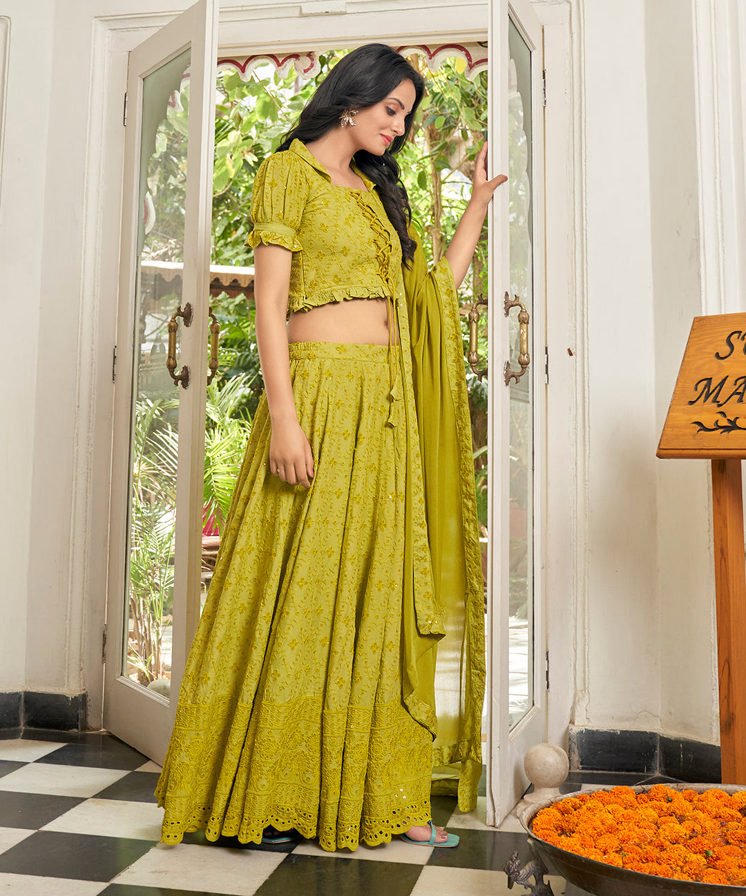 A vibrant Sunset Yellow Rayon Lehenga Set, perfect for adding a pop of color with its stylish design and comfortable fabric.