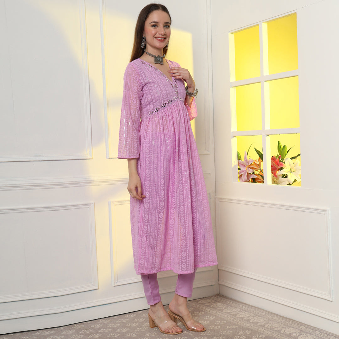 "An enchanting floral mirror work kurta set, harmonizing blooms and sparkling details."