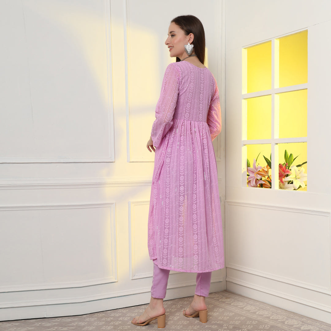 "An enchanting floral mirror work kurta set, harmonizing blooms and sparkling details."