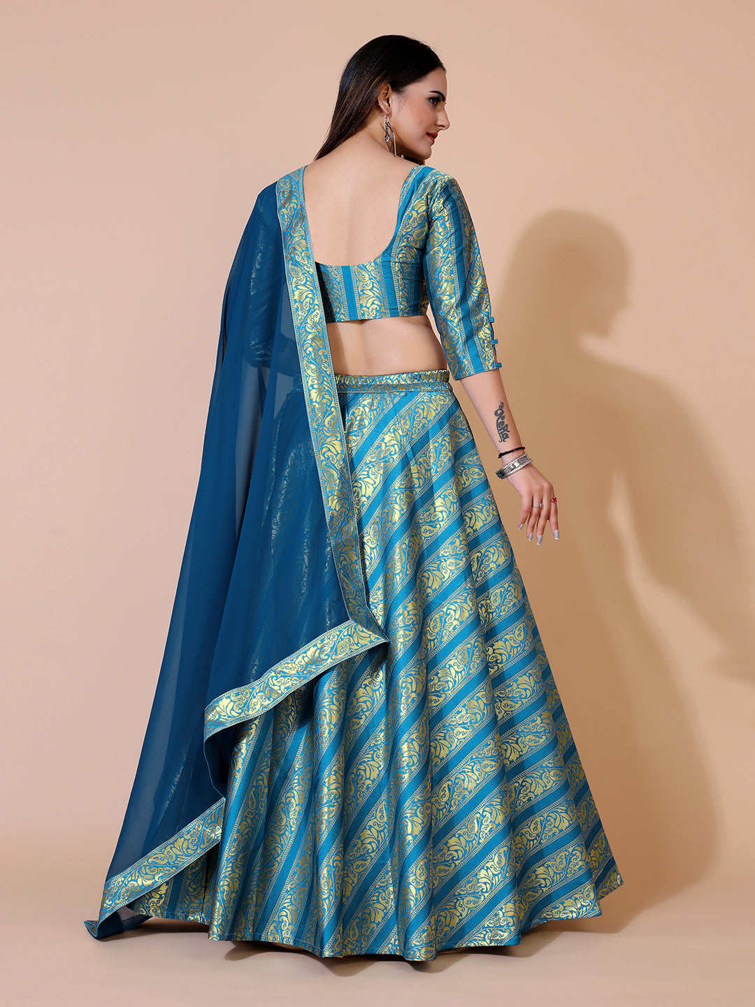 Stunning teal lehenga with a ready-to-wear blouse and matching dupatta, perfect for a festive occasion.