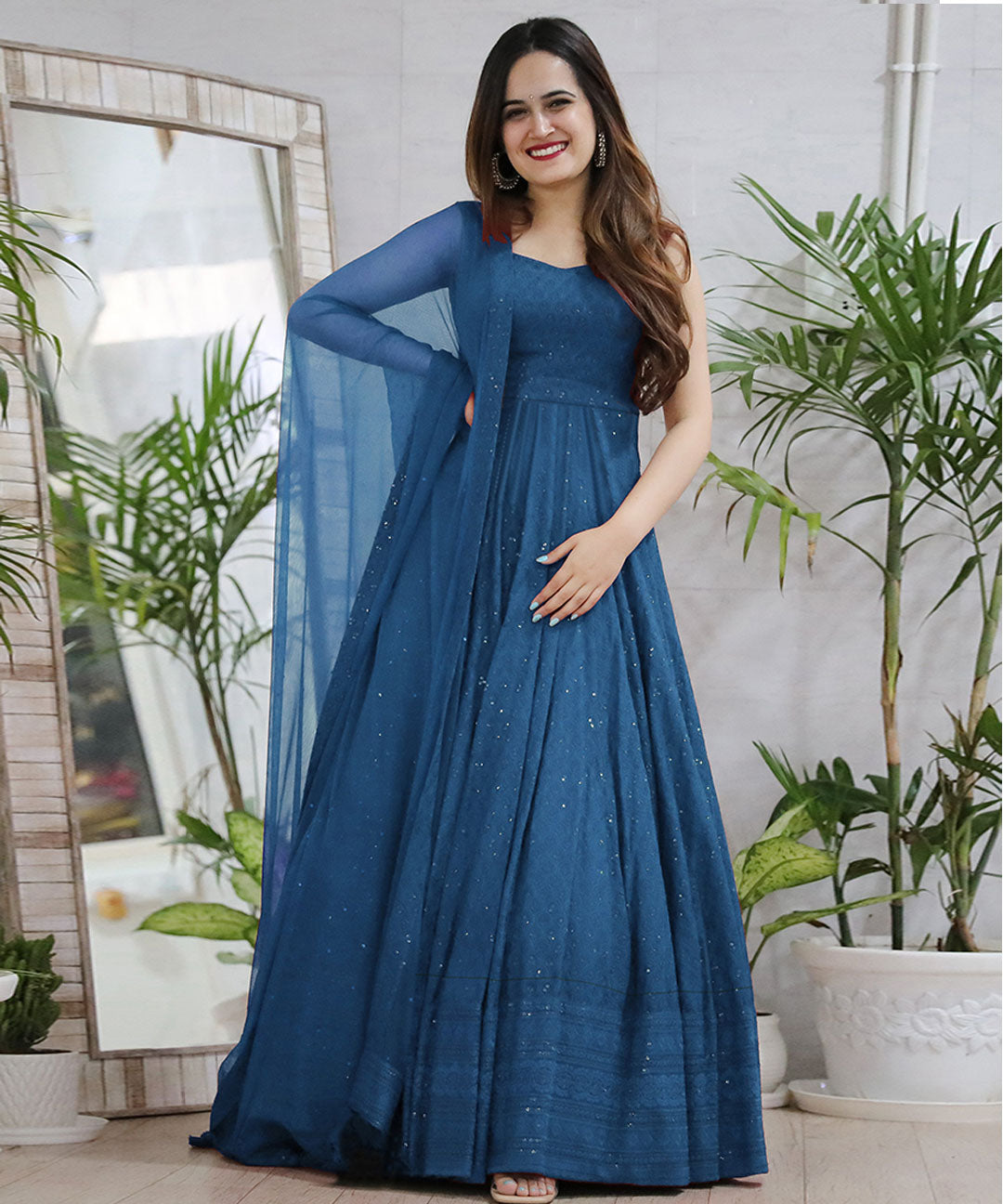 Turquoise Blue Anarkali Gown with matching Dupatta, featuring a flowing silhouette and elegant design.