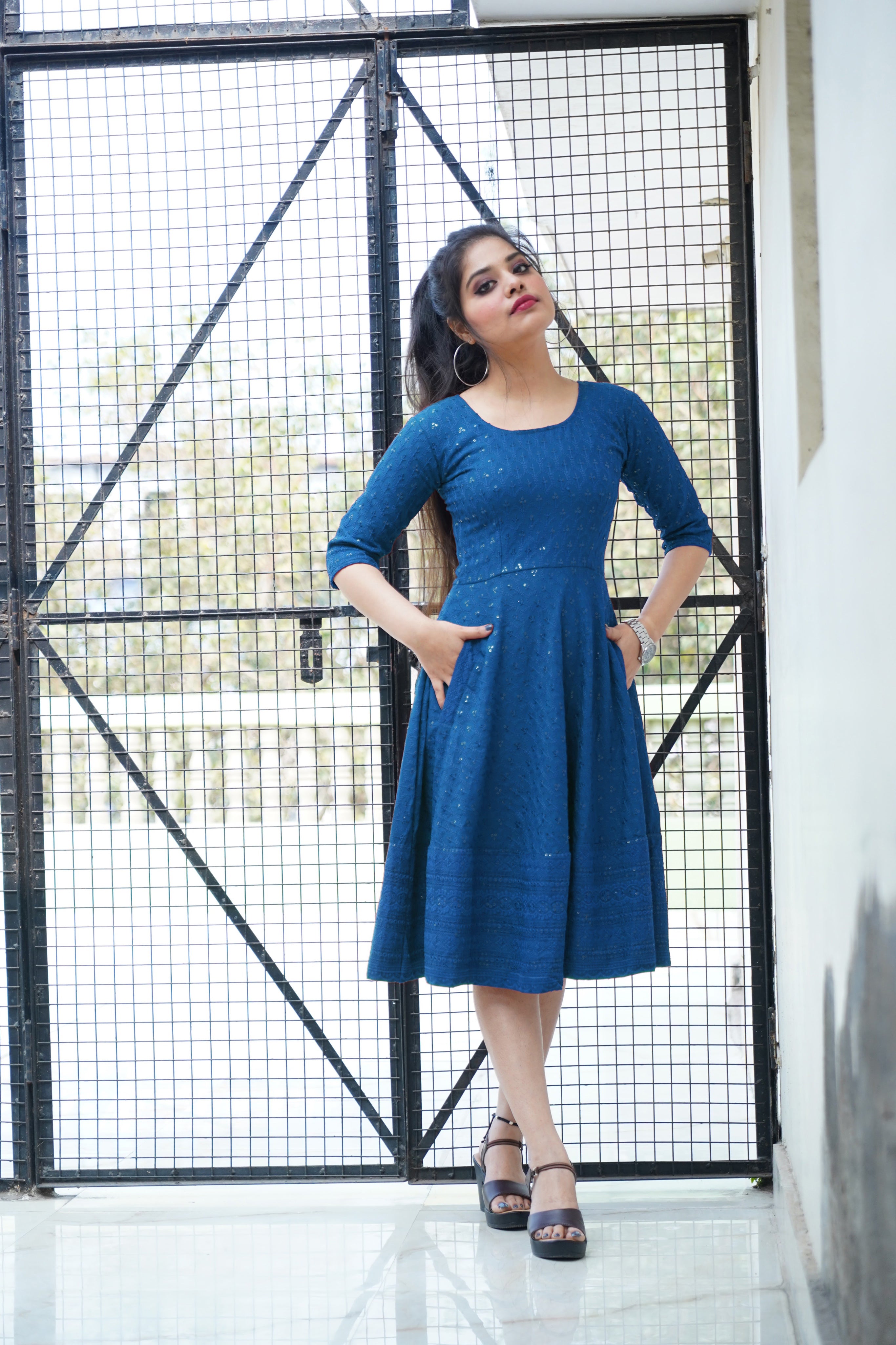 Flowing turquoise rayon dress featuring intricate Lucknowi Chikankari embroidery, perfect for parties.